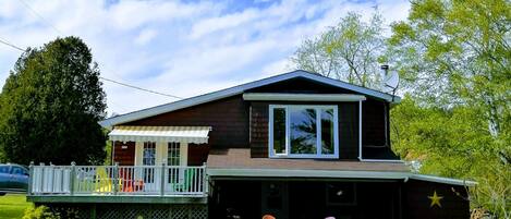 Large deck on top with awning , large deck below is screened in