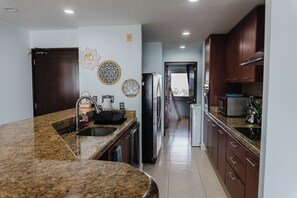 Kitchen, leading to 3rd bedroom