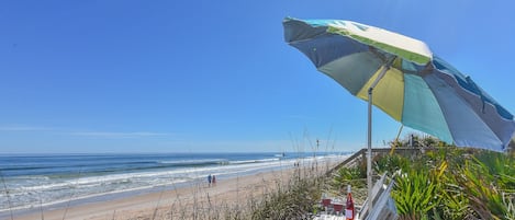 Oceanfront home with private dune deck located in serene south New Smyrna Beach.