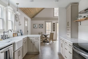 Kitchen fully stocked with all cooking essentials, oven, dishwasher, microwave, stove and drop coffee maker and keurig