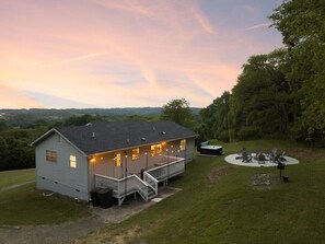 Aerial view of the home with firepit and hot tub
