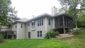 Rear of rental unit faces the Ice Age Trail and has a screened porch.