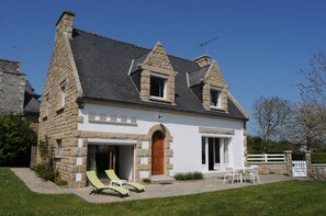 View of the HOUSE, Brittany style with a large terrace. Quiet area.