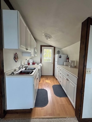 Inside the front door is the galley style kitchen.