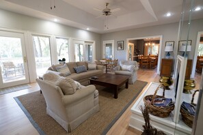 Open living room floor plan with newly refurbished wood floors