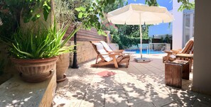 Sun loungers on the villa’s private pool area