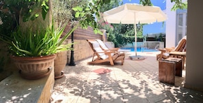 Sun loungers on the villa’s private pool area
