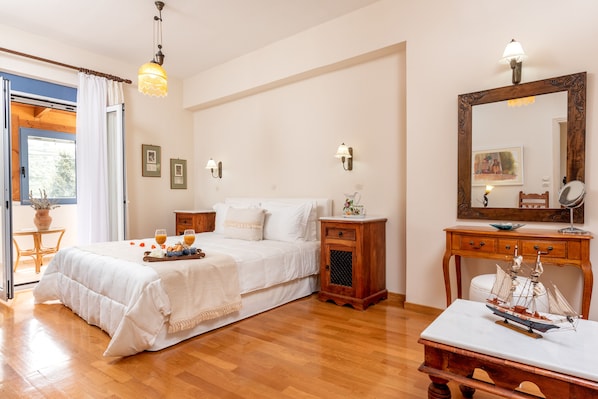 Nefeli’s king size master bedroom - en-suite balcony & bathroom in every room