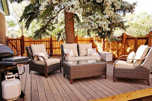 Back deck with wicker furniture
