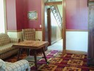 Sitting room with TV in wardrobe 