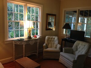 Guest House living room which opens onto 2 lovely porches, front and back.