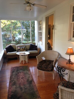 Front,screened-in porch opens to living room. 2nd porch at back.