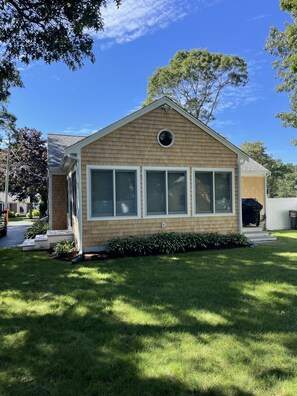 Back of house with shower on right