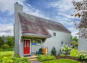 Welcome! Summer in VT.  Summer view of the house with the flowers in bloom.  