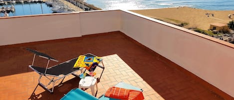 common sun roof terrace with 2 sun loungers