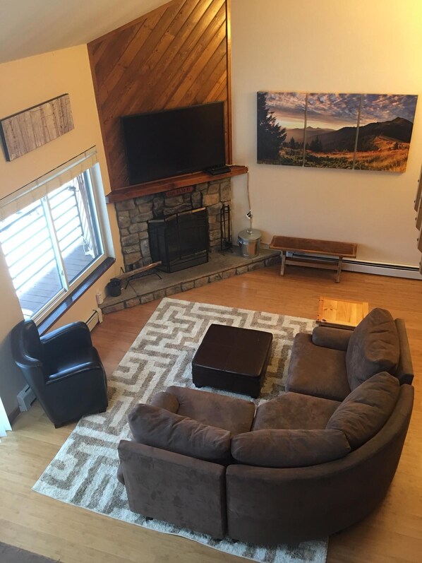 Living area with wood fireplace, cable TV and BluRay player