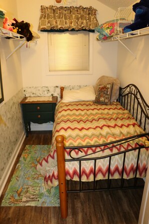 Daybed and nightstand in closet of "Noah's Ark" room 