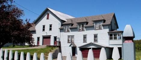 The Annex Riverfront Guesthouse with 1870's dairy barn along Barton River.