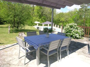 Attractive patio with a sun canopy to provide shade