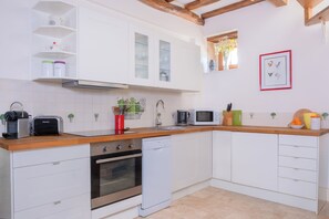 Kitchen with full range of equipment