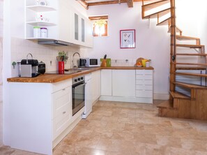 Kitchen and stairs to upstairs