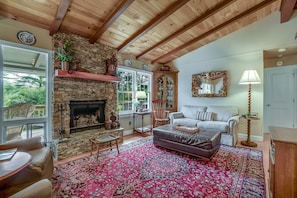 Living Room with wood burning fireplace.