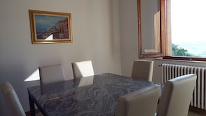 Dining Room with large Granite Top Dining Table and six dining chairs