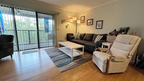 Living room.  Balcony with water views.