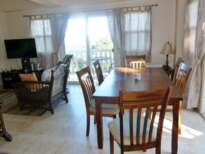 View of dining and living area with TV