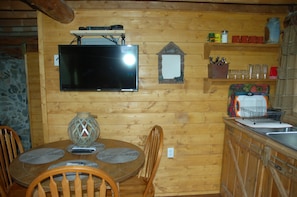 Flat Screen 32 in TV with Direct TV in Kitchenette area in Serenity Cabin
