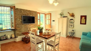The living/dining  room opens directly onto the terrace