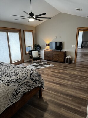 Large master suite king bed with ensuite full bath and patio overlooking lake. 