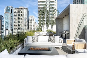 Spacious courtyard patio with BBQ grills
