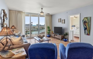 Spacious, open floor living area, designer furnished, with Gulf views.