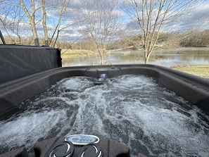 Enjoy the year round hot tub while taking in the serenity of the lake.