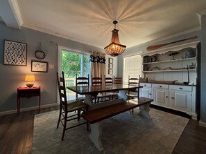Dining table seats 7-8., and opens to the kitchen and living room. 