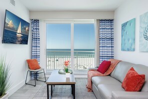 Living Room: A Bright Airy space with plush seating and stunning ocean views