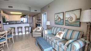 Kitchen & breakfast bar, hall to front door  bedroom.The sofa is a pull out bed