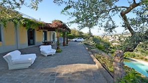 Outside villa with pool, patio and ocean view in Sorrento Coast, sant'agata book