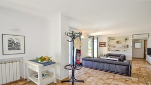 Living room/dining room with air conditioning and access patio with ocean view