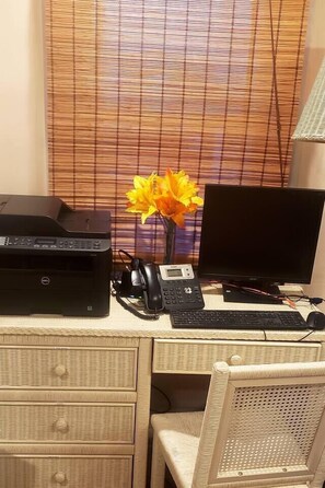 A dedicated workstation with computer monitor, keyboard, mouse, printer, business phone, Bluetooth headset, & laptop computer hookups. Everything you need for working remotely!