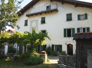 Our House, the apartment is on the top, with balcony facing the garden