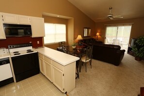 Kitchen overlooks dining and living rooms.