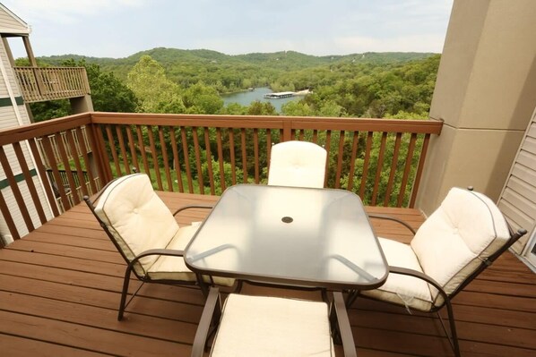 Private balcony overlooks the hills and lake.