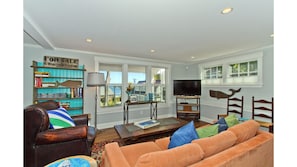 Well appointed living room with views to the harbor.