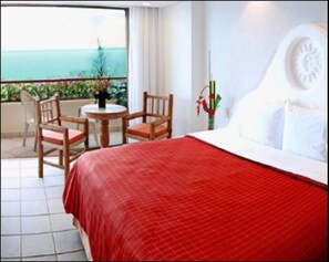 King size bed, deck, bathroom in 1st half of Presidential Suite.