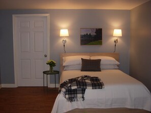 Comfortable queen bed with rolling storage drawers underneath.