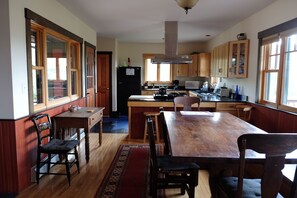 Kitchen/Dining area.  Furnishings are a mix of antique and modern.