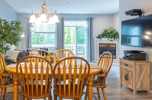The open plan kitchen and living room welcome plenty of natural light.