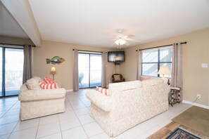 Large open living area with 57 inch cable television 